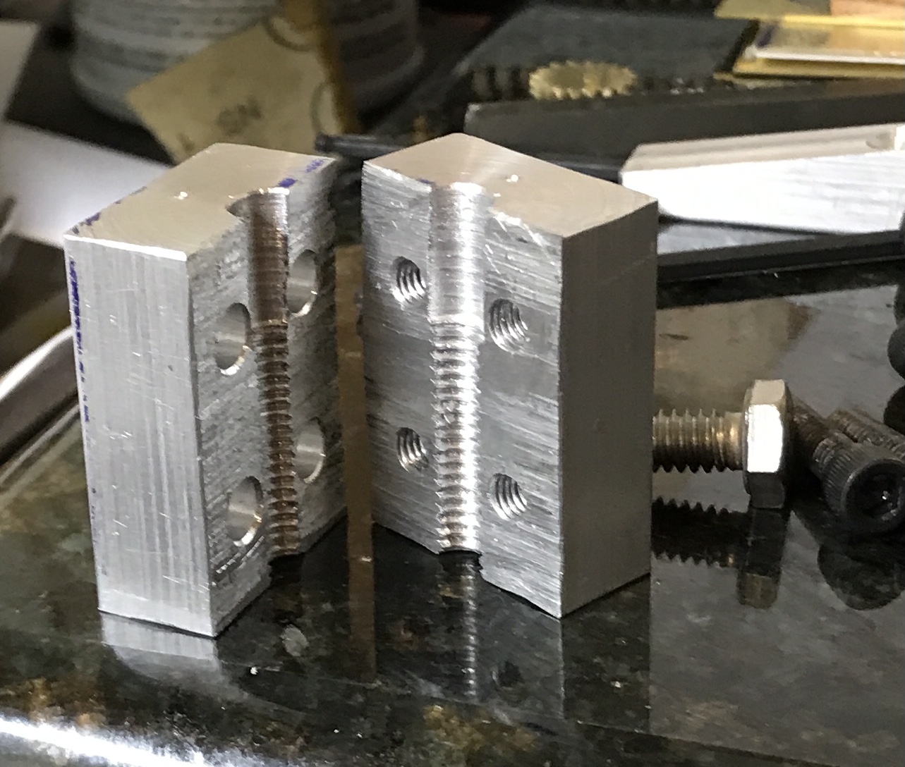 The two halves of the screw holding jig